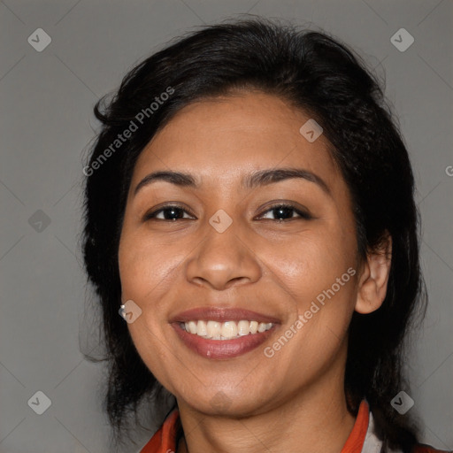 Joyful latino young-adult female with long  brown hair and brown eyes