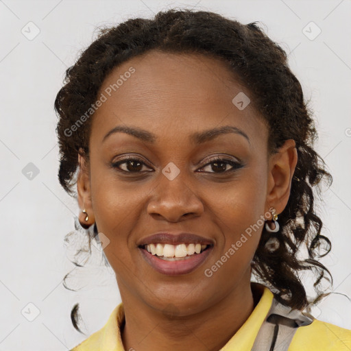 Joyful black young-adult female with long  brown hair and brown eyes