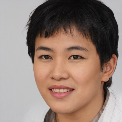 Joyful asian young-adult female with medium  brown hair and brown eyes