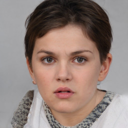 Neutral white young-adult female with short  brown hair and grey eyes