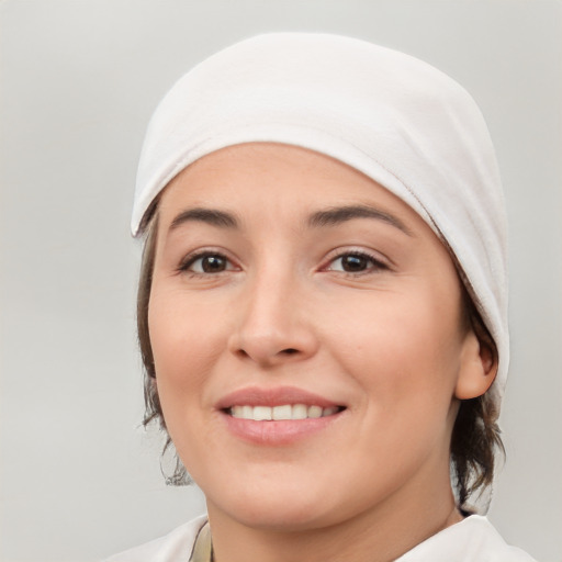 Joyful white young-adult female with medium  brown hair and brown eyes