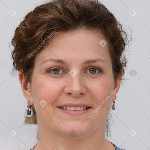 Joyful white adult female with short  brown hair and grey eyes