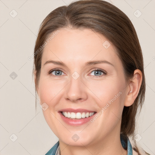 Joyful white young-adult female with medium  brown hair and blue eyes