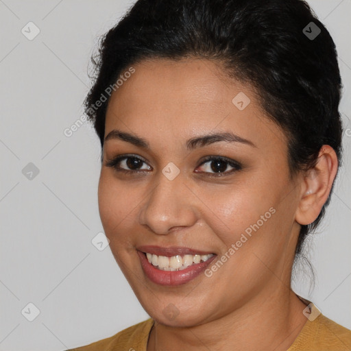 Joyful latino young-adult female with short  brown hair and brown eyes