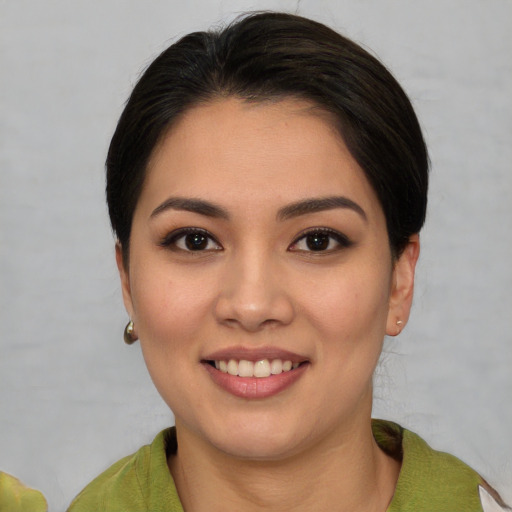 Joyful white young-adult female with medium  brown hair and brown eyes