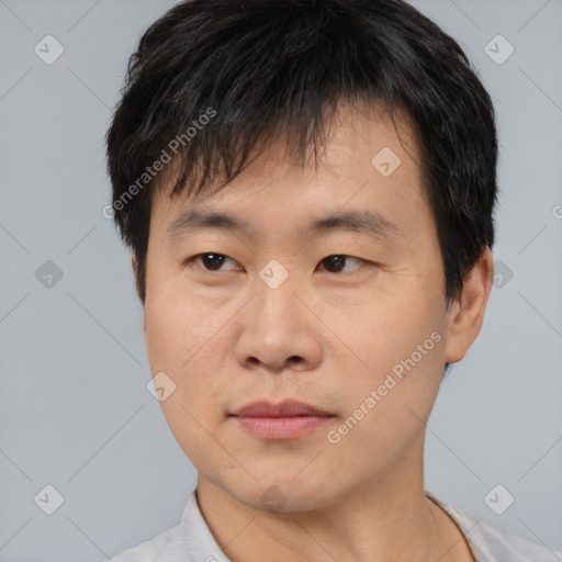 Neutral asian young-adult male with short  brown hair and brown eyes