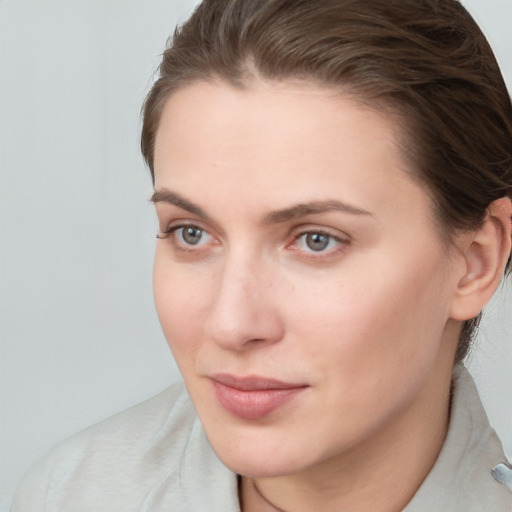 Neutral white young-adult female with short  brown hair and brown eyes