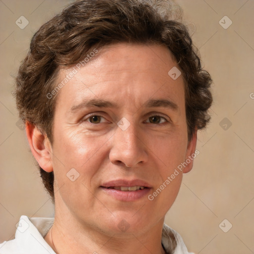 Joyful white adult male with short  brown hair and grey eyes