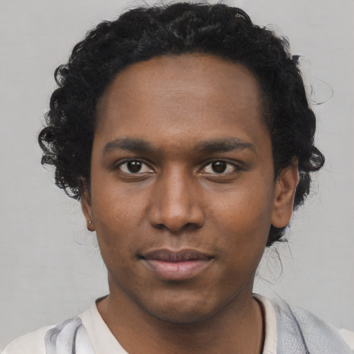 Neutral black young-adult male with short  black hair and brown eyes
