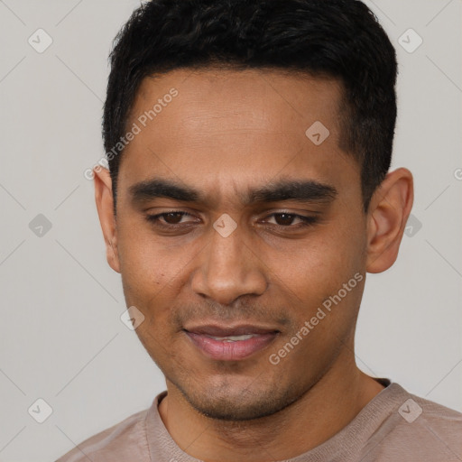 Joyful latino young-adult male with short  black hair and brown eyes