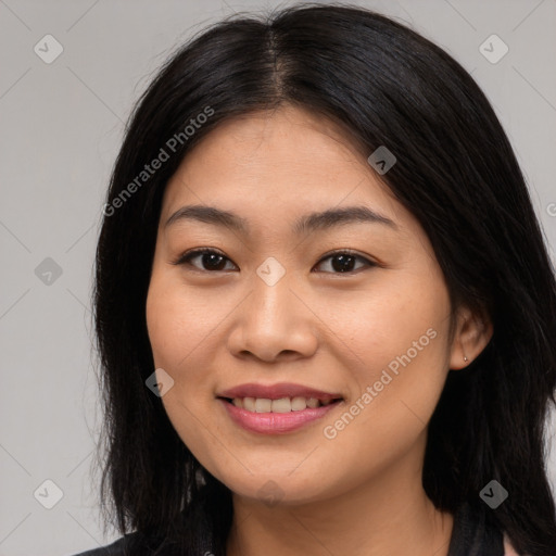 Joyful asian young-adult female with long  brown hair and brown eyes