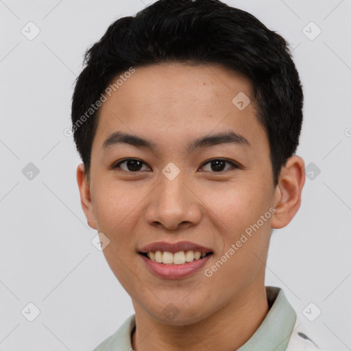 Joyful asian young-adult male with short  black hair and brown eyes