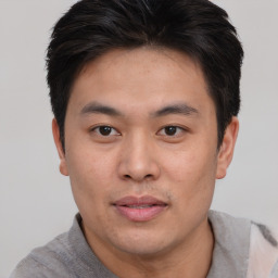 Neutral asian young-adult male with short  brown hair and brown eyes