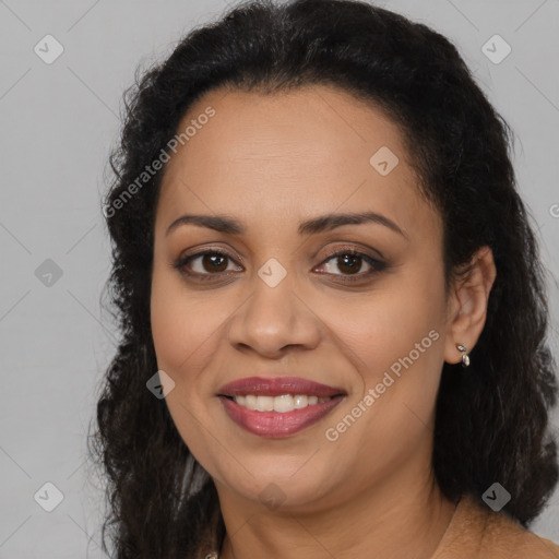 Joyful latino adult female with long  brown hair and brown eyes