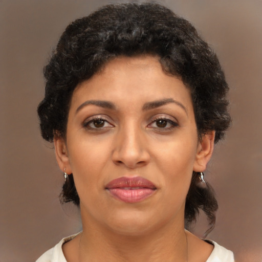 Joyful latino young-adult female with short  brown hair and brown eyes