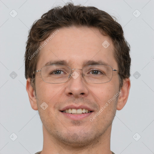 Joyful white adult male with short  brown hair and brown eyes