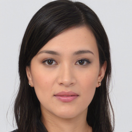 Joyful white young-adult female with long  black hair and brown eyes