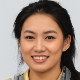 Joyful asian young-adult female with medium  brown hair and brown eyes