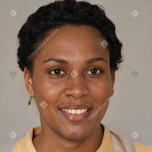 Joyful black adult female with short  brown hair and brown eyes