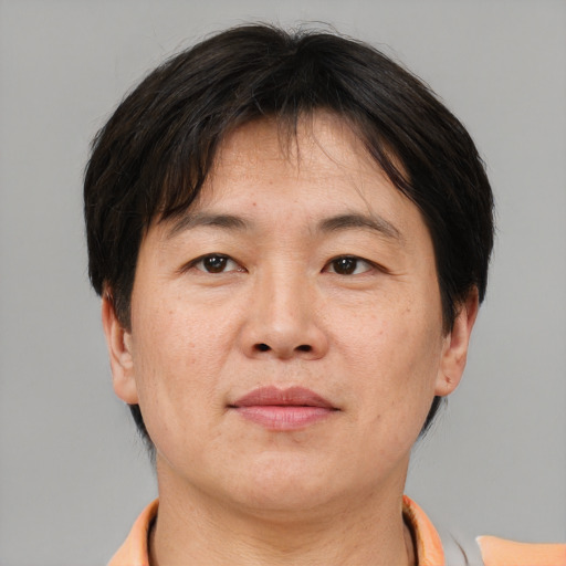 Neutral asian adult male with short  brown hair and brown eyes