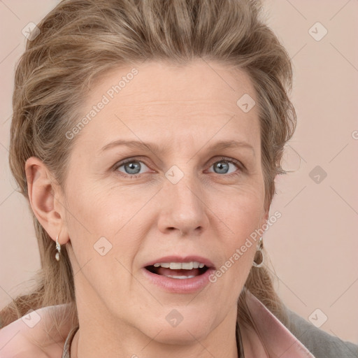 Joyful white adult female with medium  brown hair and grey eyes