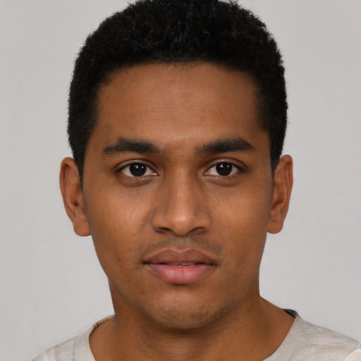 Neutral black young-adult male with short  black hair and brown eyes