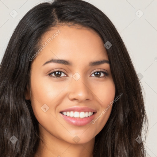 Joyful latino young-adult female with long  brown hair and brown eyes