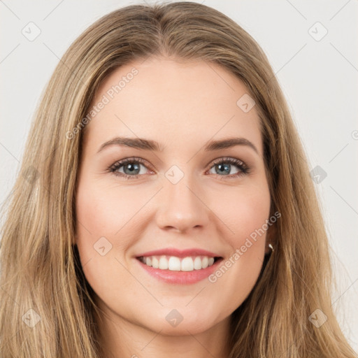 Joyful white young-adult female with long  brown hair and green eyes