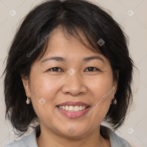 Joyful white adult female with medium  brown hair and brown eyes