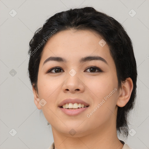 Joyful asian young-adult female with medium  black hair and brown eyes