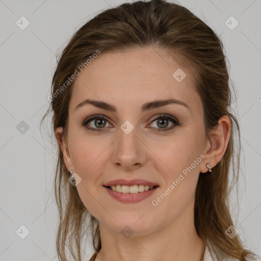 Joyful white young-adult female with long  brown hair and grey eyes