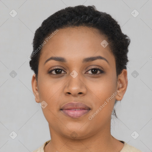 Joyful black young-adult female with short  black hair and brown eyes