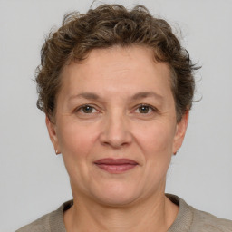 Joyful white adult female with short  brown hair and grey eyes