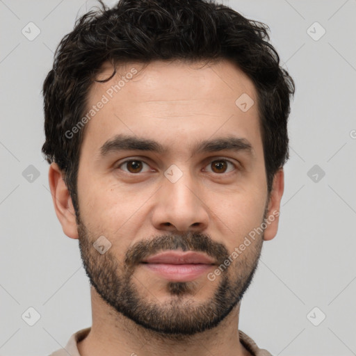 Joyful white young-adult male with short  black hair and brown eyes