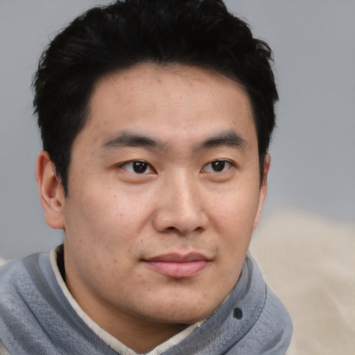 Neutral asian young-adult male with short  black hair and brown eyes