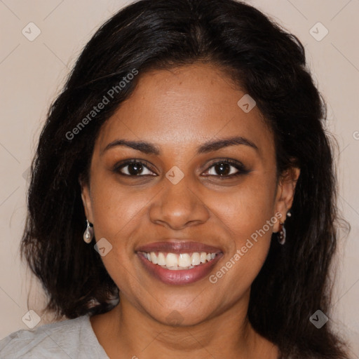 Joyful black young-adult female with long  brown hair and brown eyes