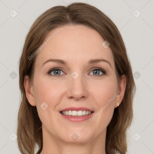 Joyful white young-adult female with long  brown hair and grey eyes