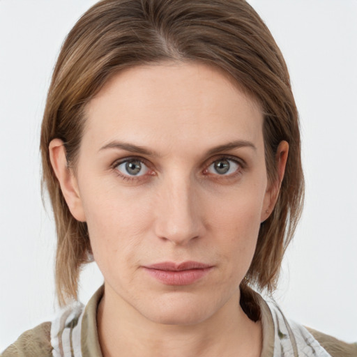 Neutral white young-adult female with medium  brown hair and grey eyes