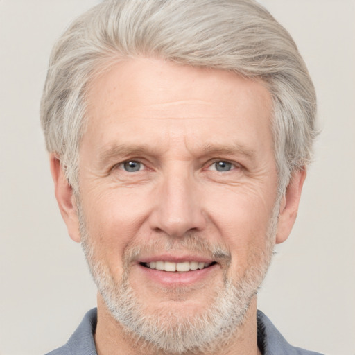 Joyful white middle-aged male with short  gray hair and grey eyes