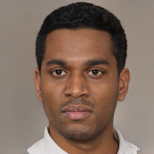 Neutral latino young-adult male with short  black hair and brown eyes