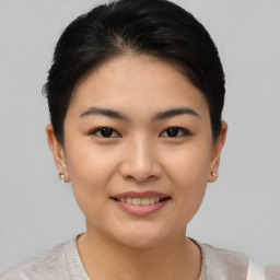 Joyful asian young-adult female with short  black hair and brown eyes