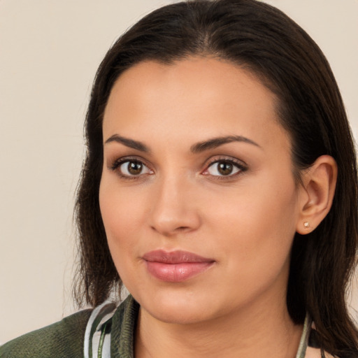 Joyful white young-adult female with long  brown hair and brown eyes