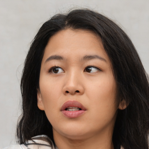Neutral asian young-adult female with medium  black hair and brown eyes