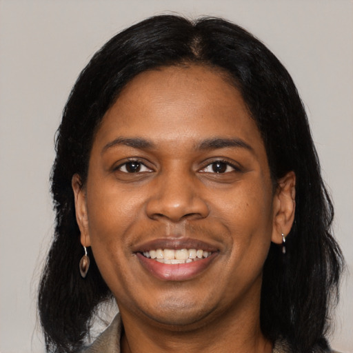 Joyful black young-adult female with medium  black hair and brown eyes