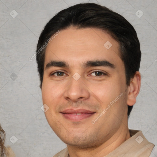 Joyful white young-adult male with short  black hair and brown eyes