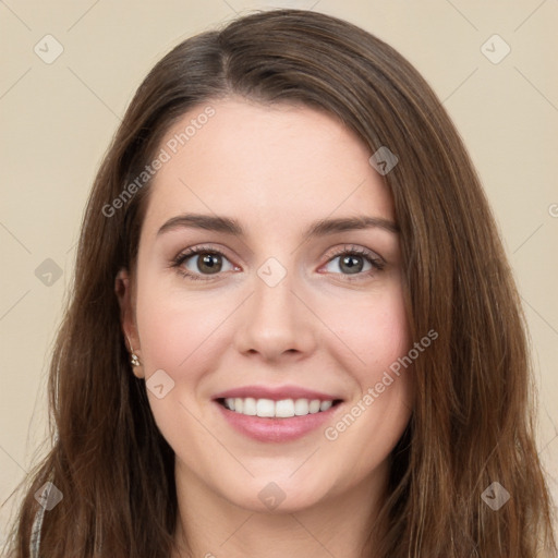 Joyful white young-adult female with long  brown hair and green eyes