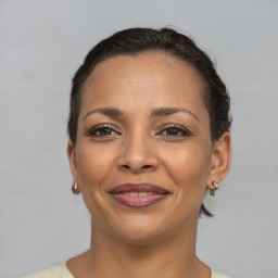 Joyful white adult female with short  brown hair and brown eyes