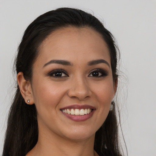 Joyful white young-adult female with long  brown hair and brown eyes