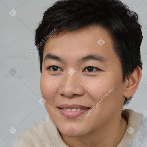 Joyful asian young-adult male with short  brown hair and brown eyes