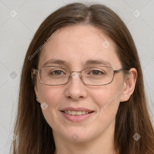 Joyful white adult female with long  brown hair and grey eyes